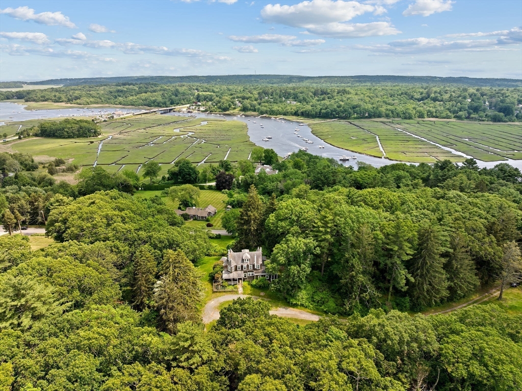 48 Neal Gate Street Scituate, MA 02066 - Photo 3 of 34 a view of a lake with a big yard
