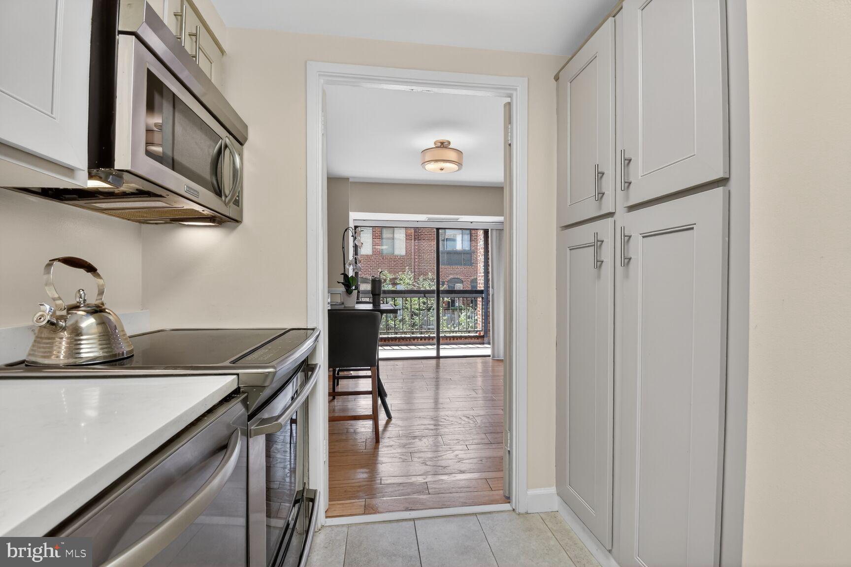 3225 Grace Street Northwest, Unit 101 Washington, DC 20007 - Photo 10 of 26 GALLEY KITCHEN WITH STORAGE