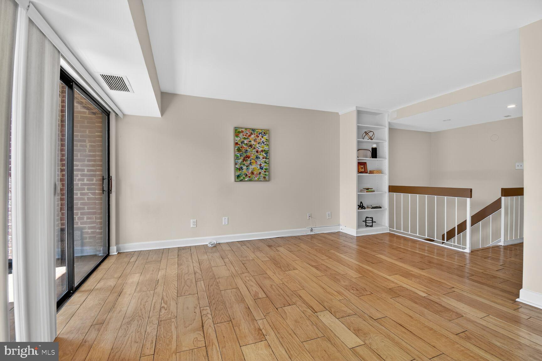 3225 Grace Street Northwest, Unit 101 Washington, DC 20007 - Photo 11 of 26 FROM OUTDOOR SPACE LOOKING AT LIVING/DINING SPACE