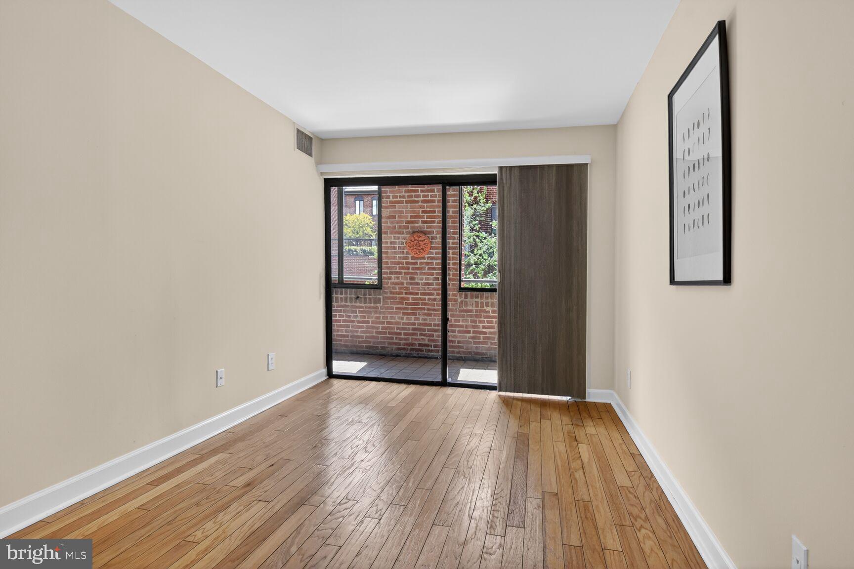 3225 Grace Street Northwest, Unit 101 Washington, DC 20007 - Photo 22 of 26 GUEST BEDROOM AND OUTDOOR SPACE