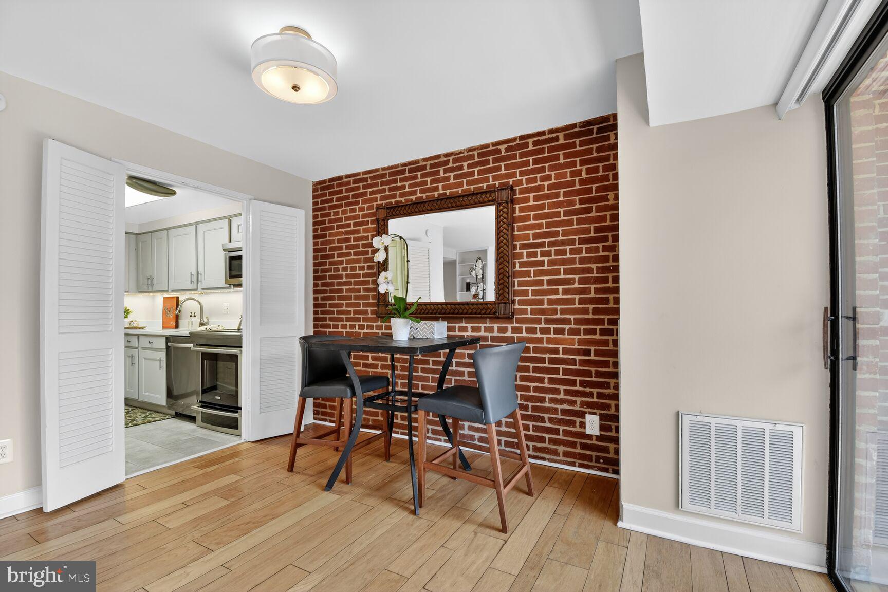 3225 Grace Street Northwest, Unit 101 Washington, DC 20007 - Photo 6 of 26 EXPOSED BRICK WALL