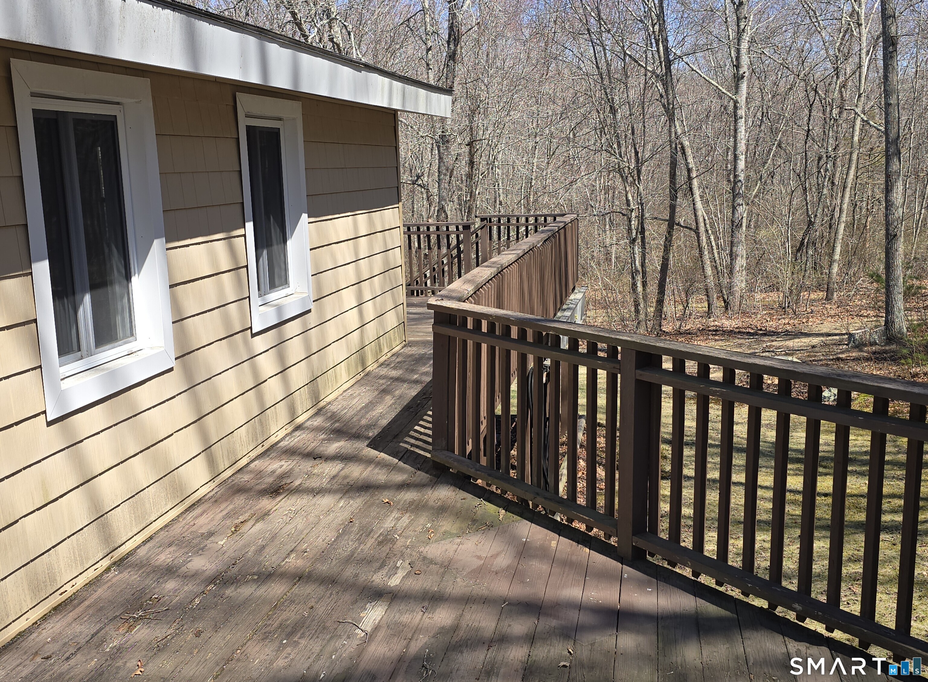 34 Country Club Drive Ledyard, CT 06339 - Photo 17 of 21 a view of a balcony with wooden floor and fence