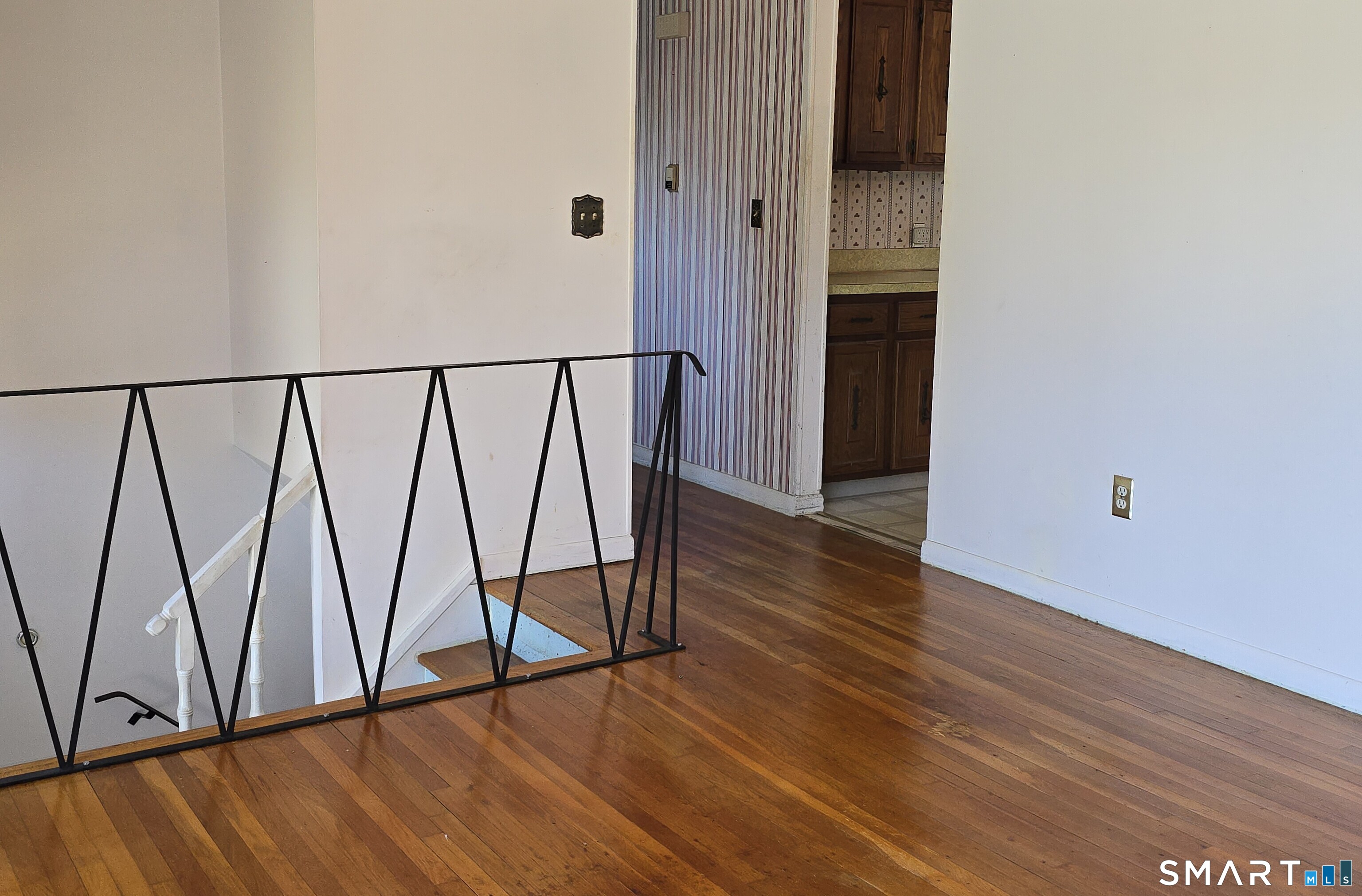 34 Country Club Drive Ledyard, CT 06339 - Photo 5 of 21 a view of a hallway with wooden floor and staircase