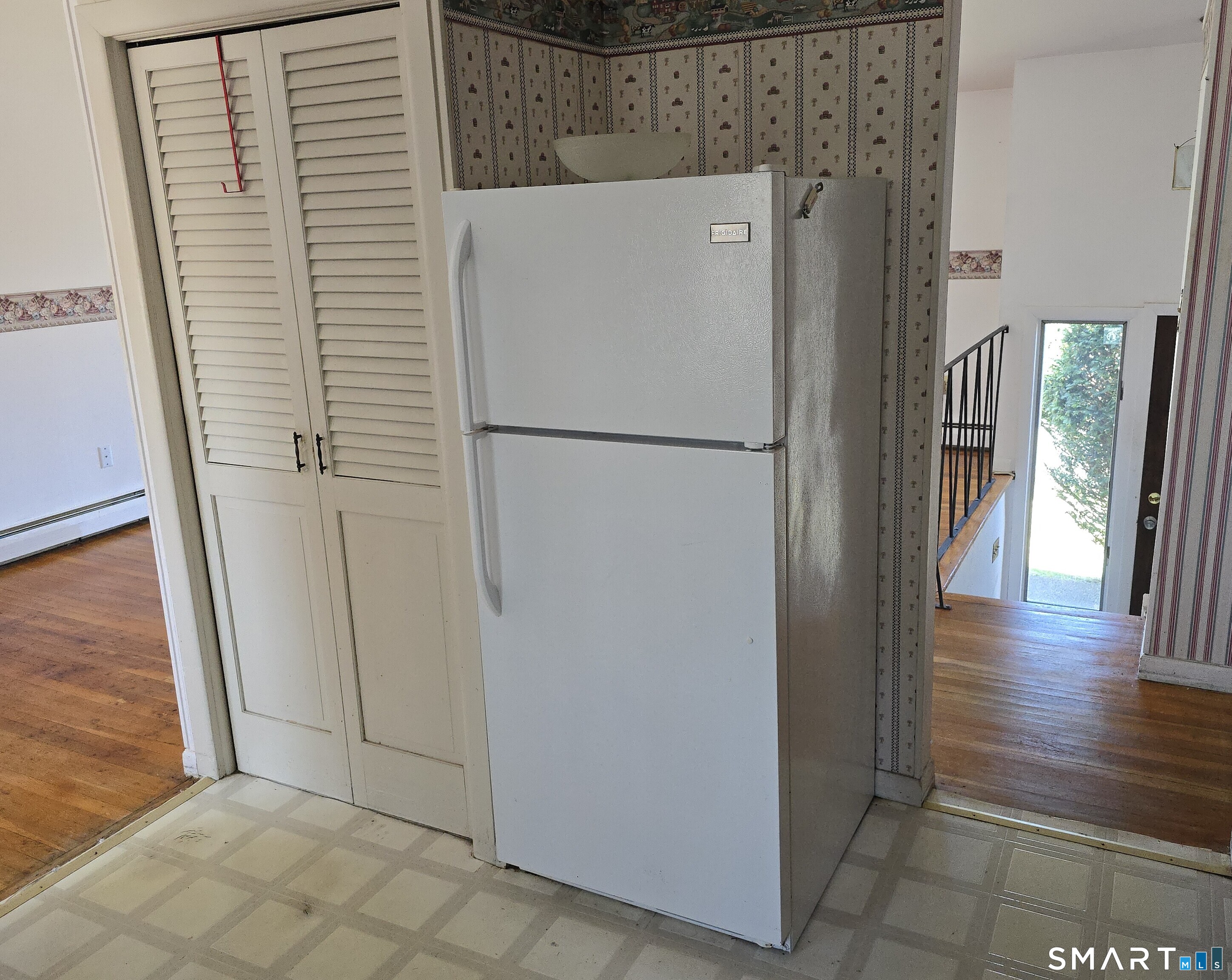 34 Country Club Drive Ledyard, CT 06339 - Photo 8 of 21 a view of a hallway with wooden floor and staircase