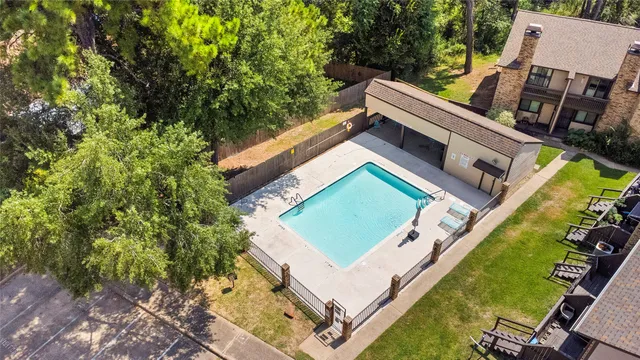 a wooden bench sitting in front of a building