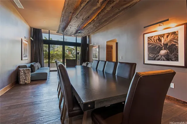 a view of a dining room with furniture window and wooden floor