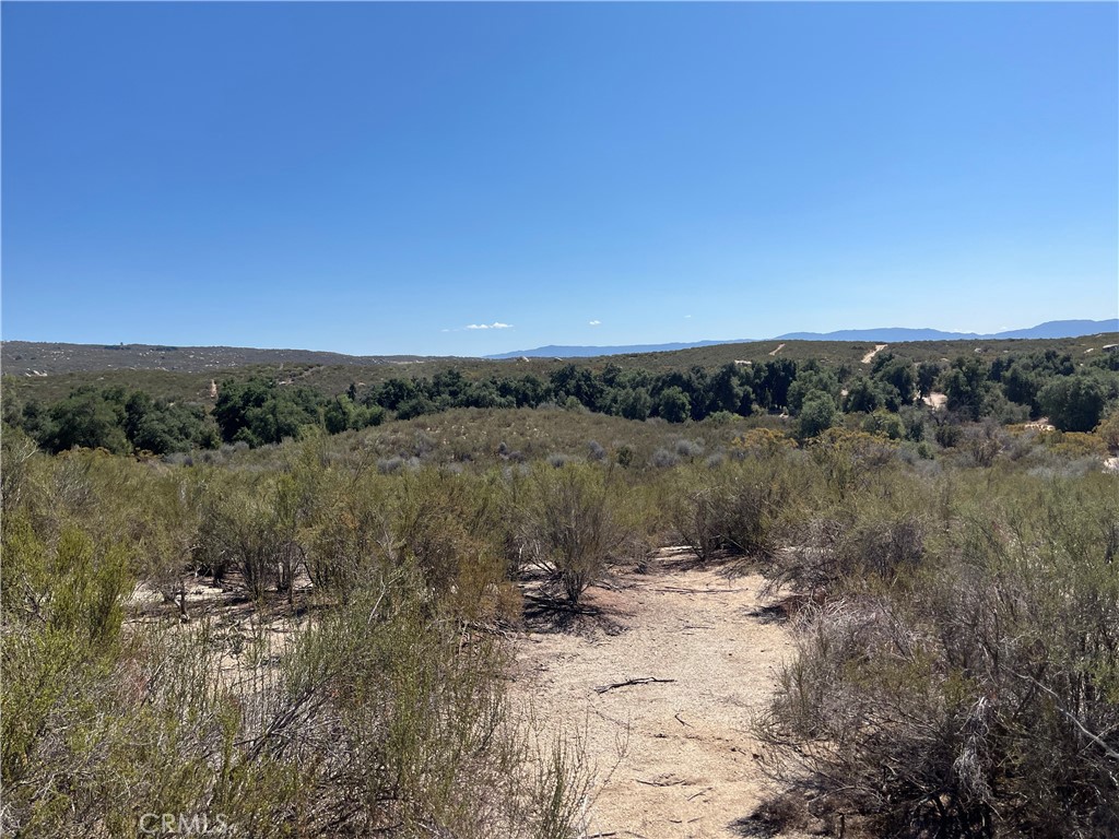35010 Willow Creek Road Hemet, CA 92544 - Photo 24 of 26 a view of a lake with houses in the back