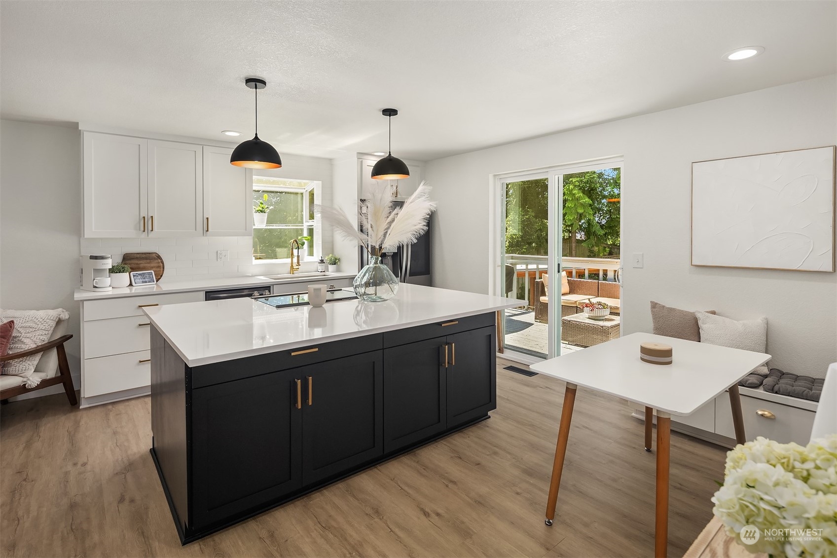 18216 19th Drive Southeast Bothell, WA 98012 - Photo 13 of 33 a kitchen with a sink cabinets and wooden floor