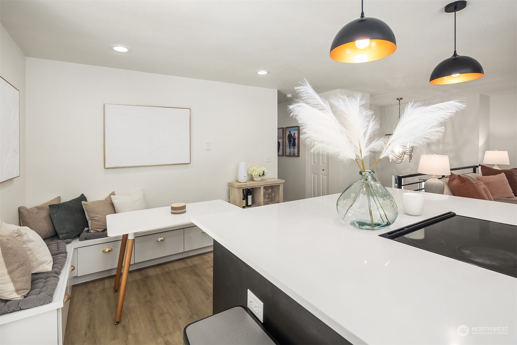 18216 19th Drive Southeast Bothell, WA 98012 - Photo 15 of 33 a kitchen with a table chairs stove and wooden floor