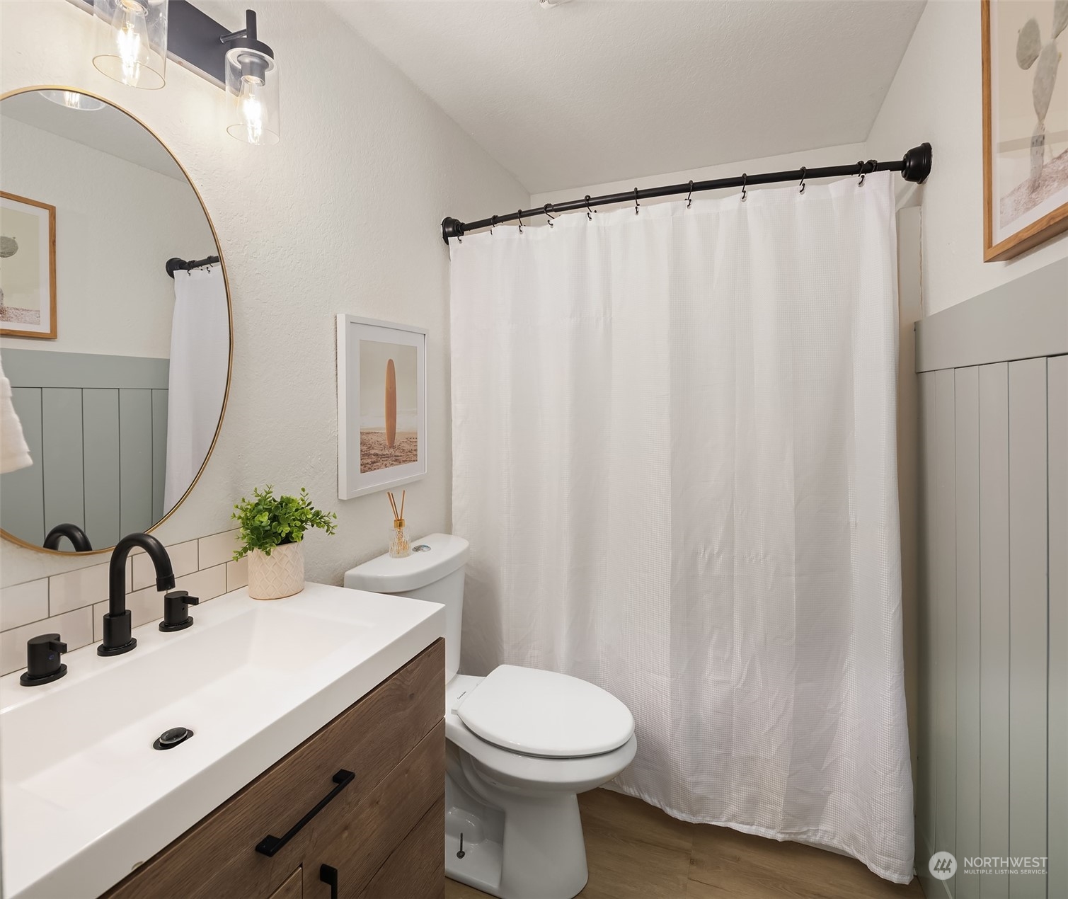 18216 19th Drive Southeast Bothell, WA 98012 - Photo 16 of 33 a bathroom with a sink a toilet and a mirror