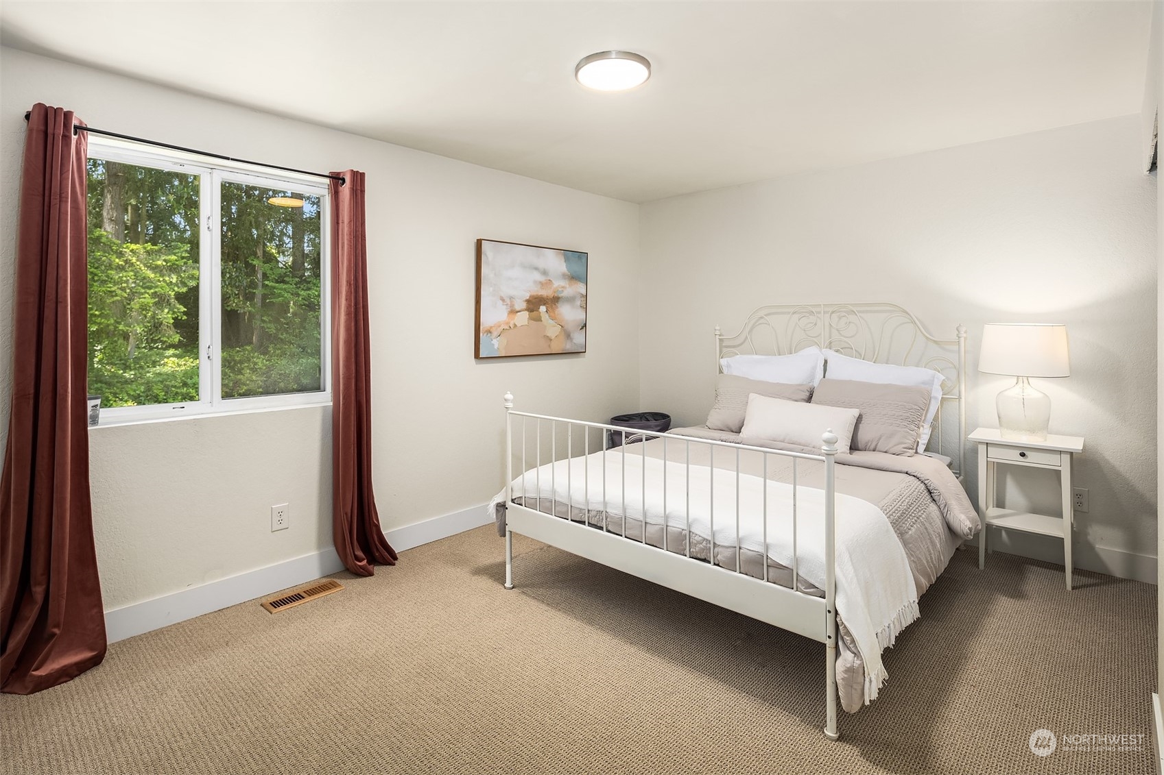 18216 19th Drive Southeast Bothell, WA 98012 - Photo 17 of 33 a large bed sitting in a bedroom next to a window