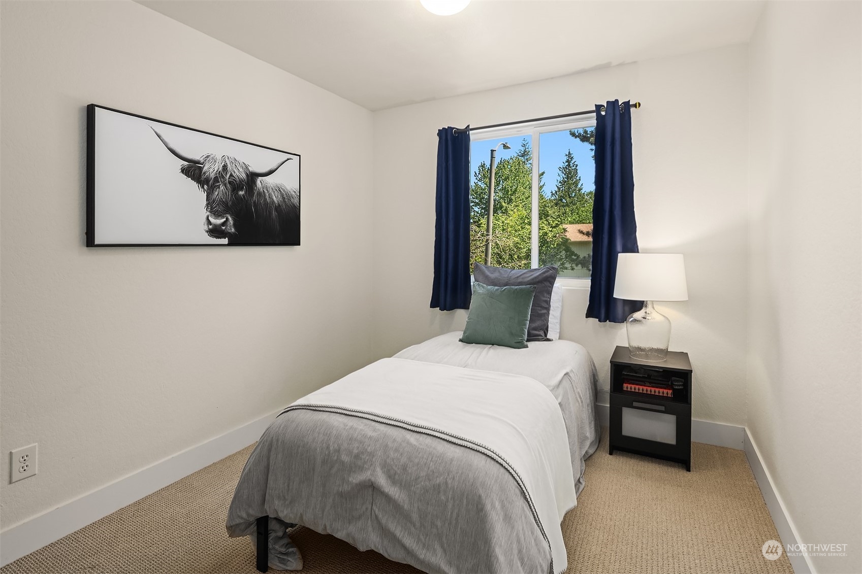 18216 19th Drive Southeast Bothell, WA 98012 - Photo 19 of 33 a bedroom with a bed and a painting on the wall