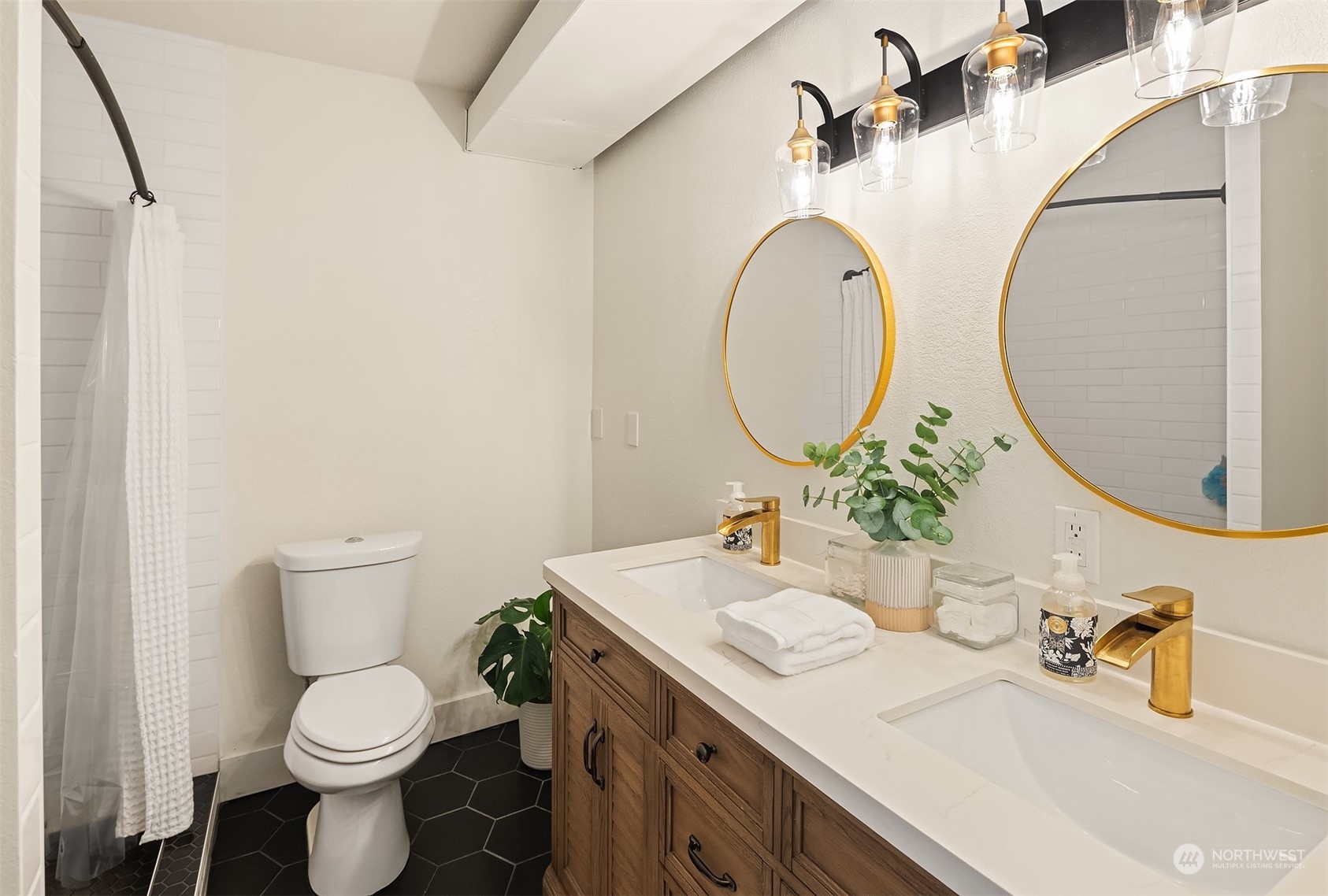 18216 19th Drive Southeast Bothell, WA 98012 - Photo 23 of 33 a bathroom with a toilet sink and mirror