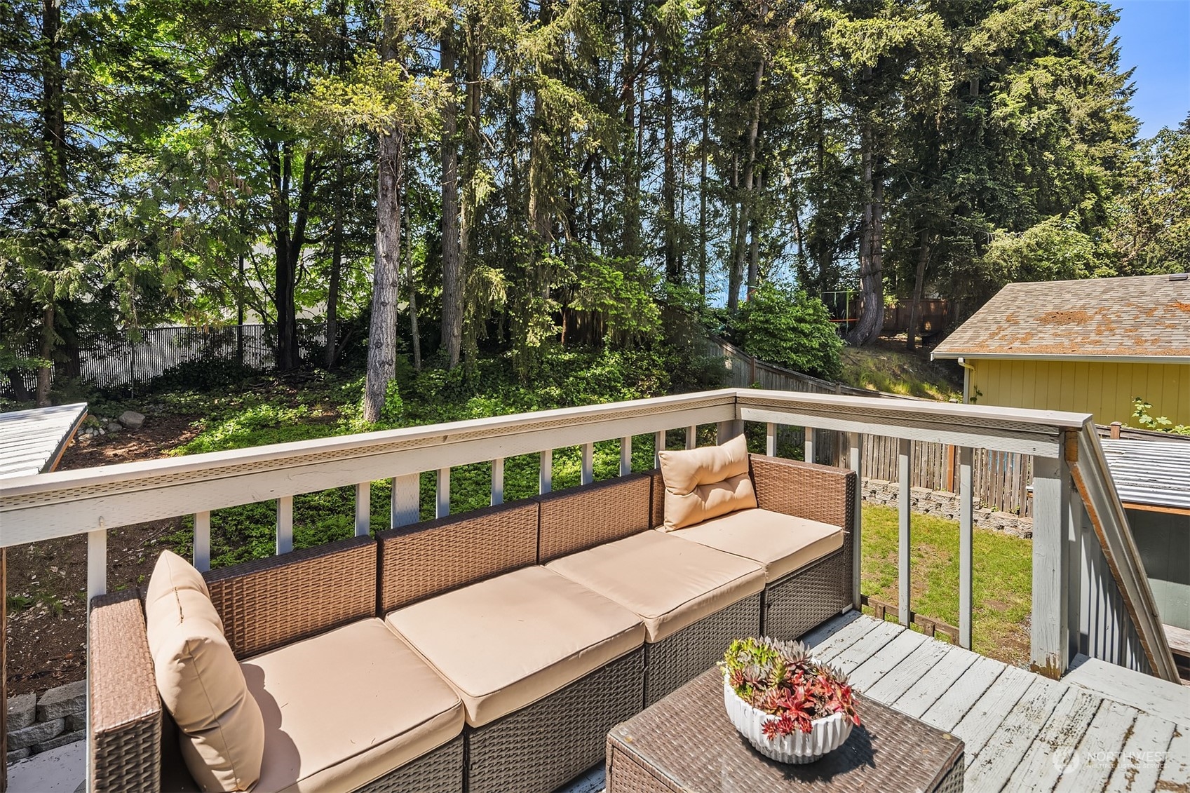 18216 19th Drive Southeast Bothell, WA 98012 - Photo 28 of 33 a balcony with wooden floor and outdoor seating