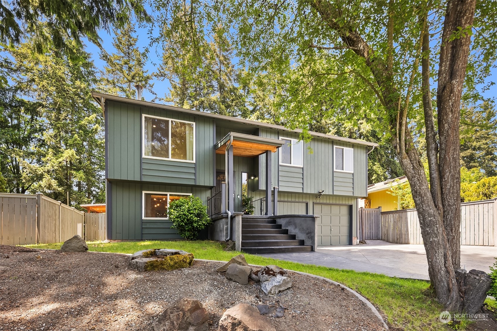18216 19th Drive Southeast Bothell, WA 98012 - Photo 4 of 33 a front view of a house with garden