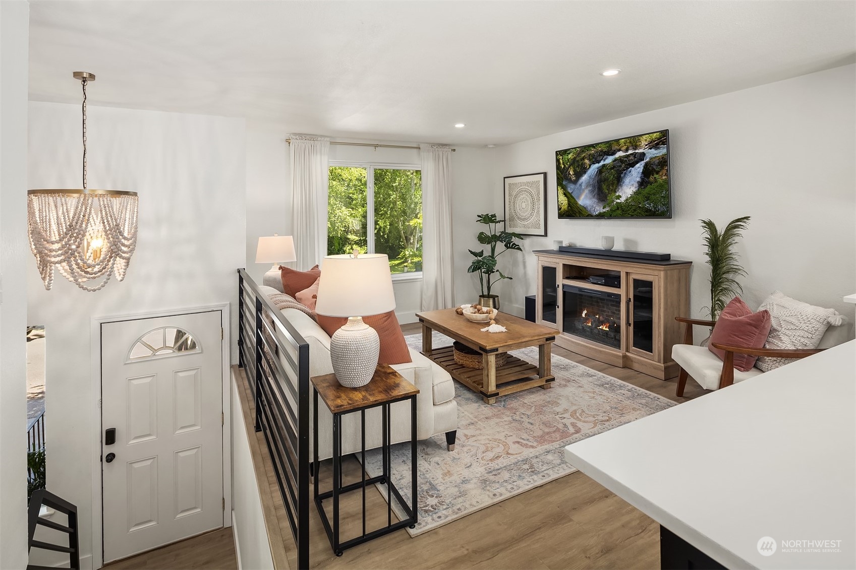 18216 19th Drive Southeast Bothell, WA 98012 - Photo 10 of 33 a living room with furniture a fireplace and a flat screen tv