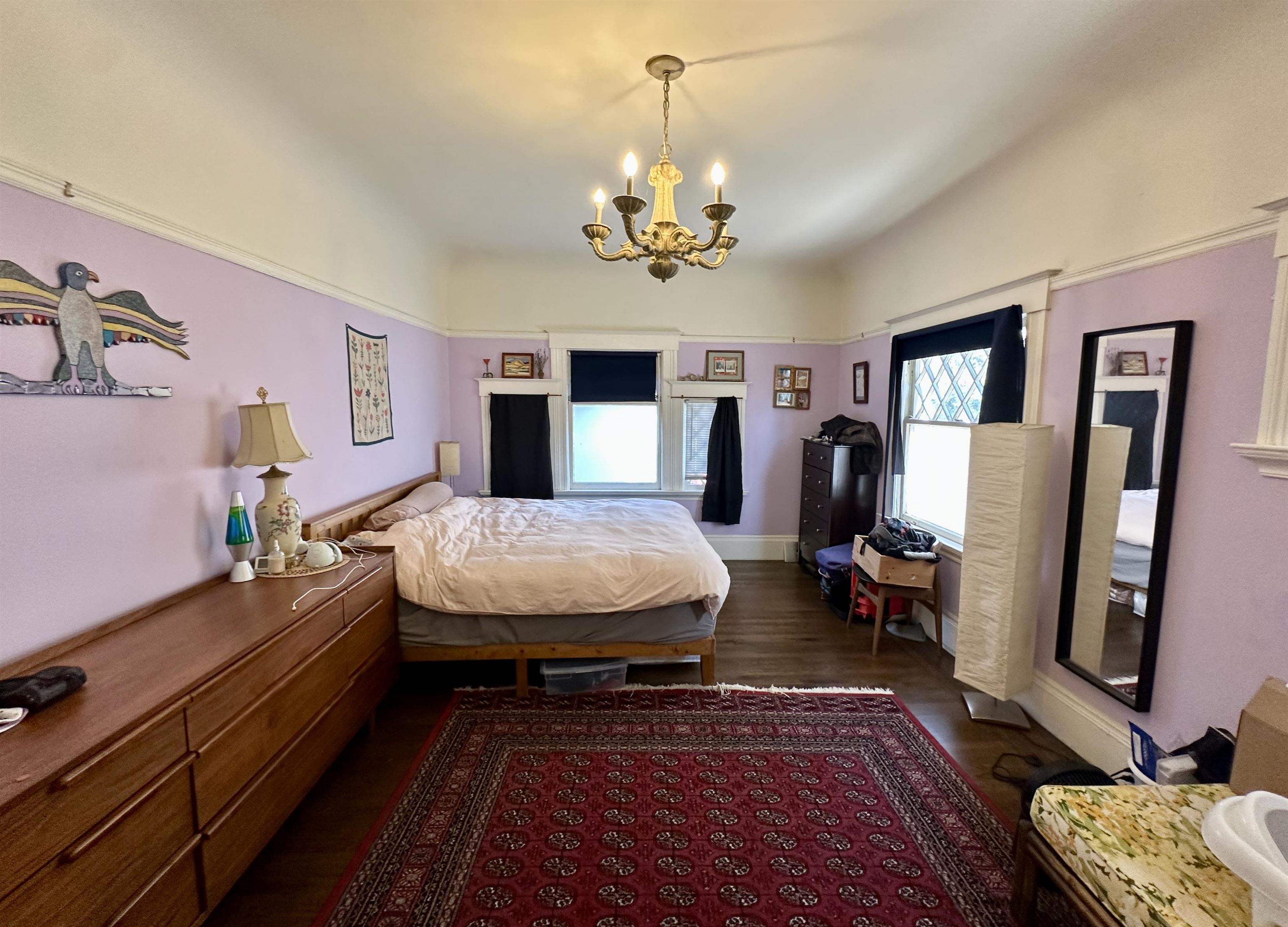 667 10th Street Oakland, CA 94607 - Photo 11 of 18 Bedroom featuring hanging lights and dark wood-type flooring