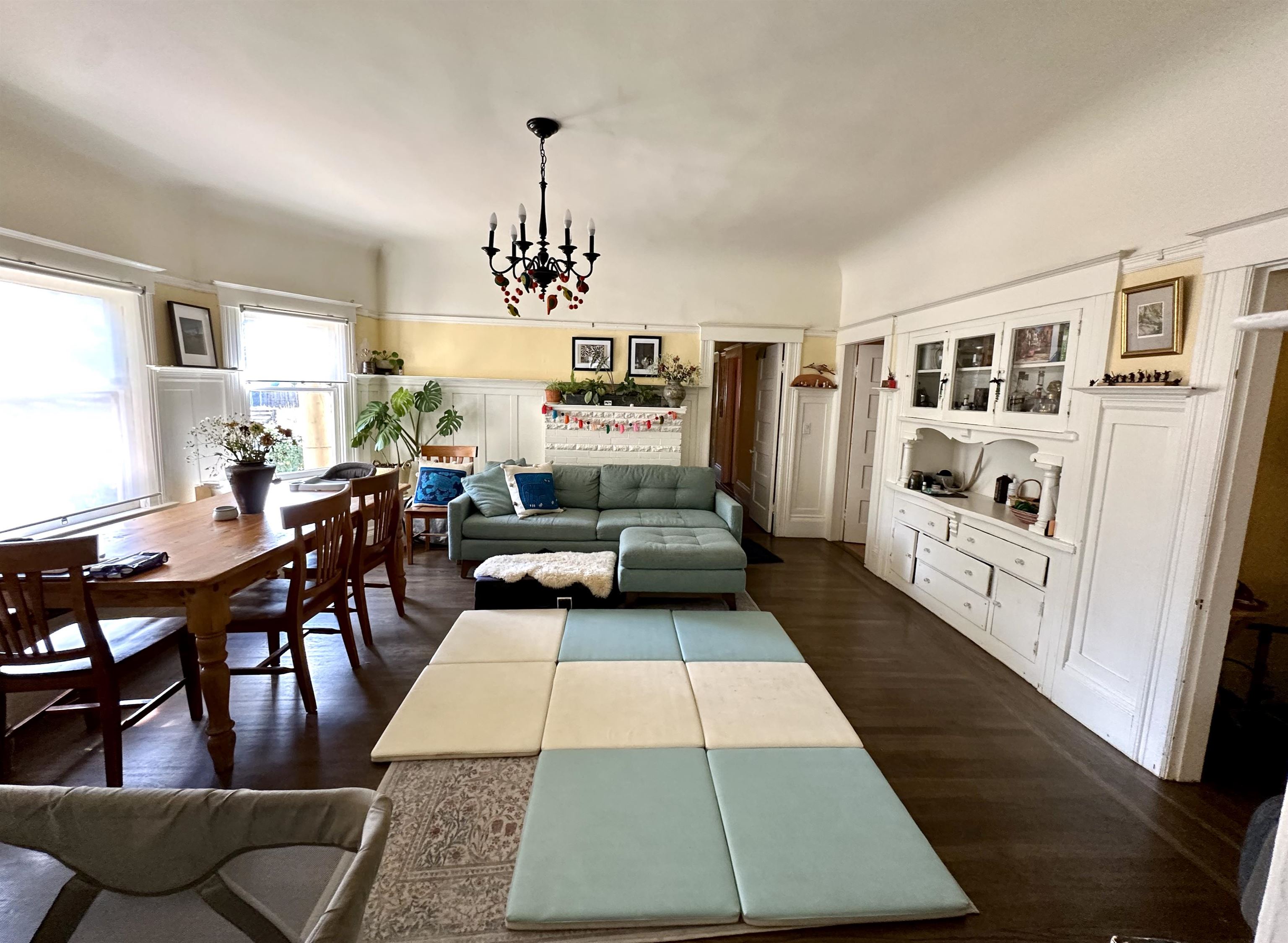 667 10th Street Oakland, CA 94607 - Photo 9 of 18 Living area featuring hanging lights and dark wood-type flooring