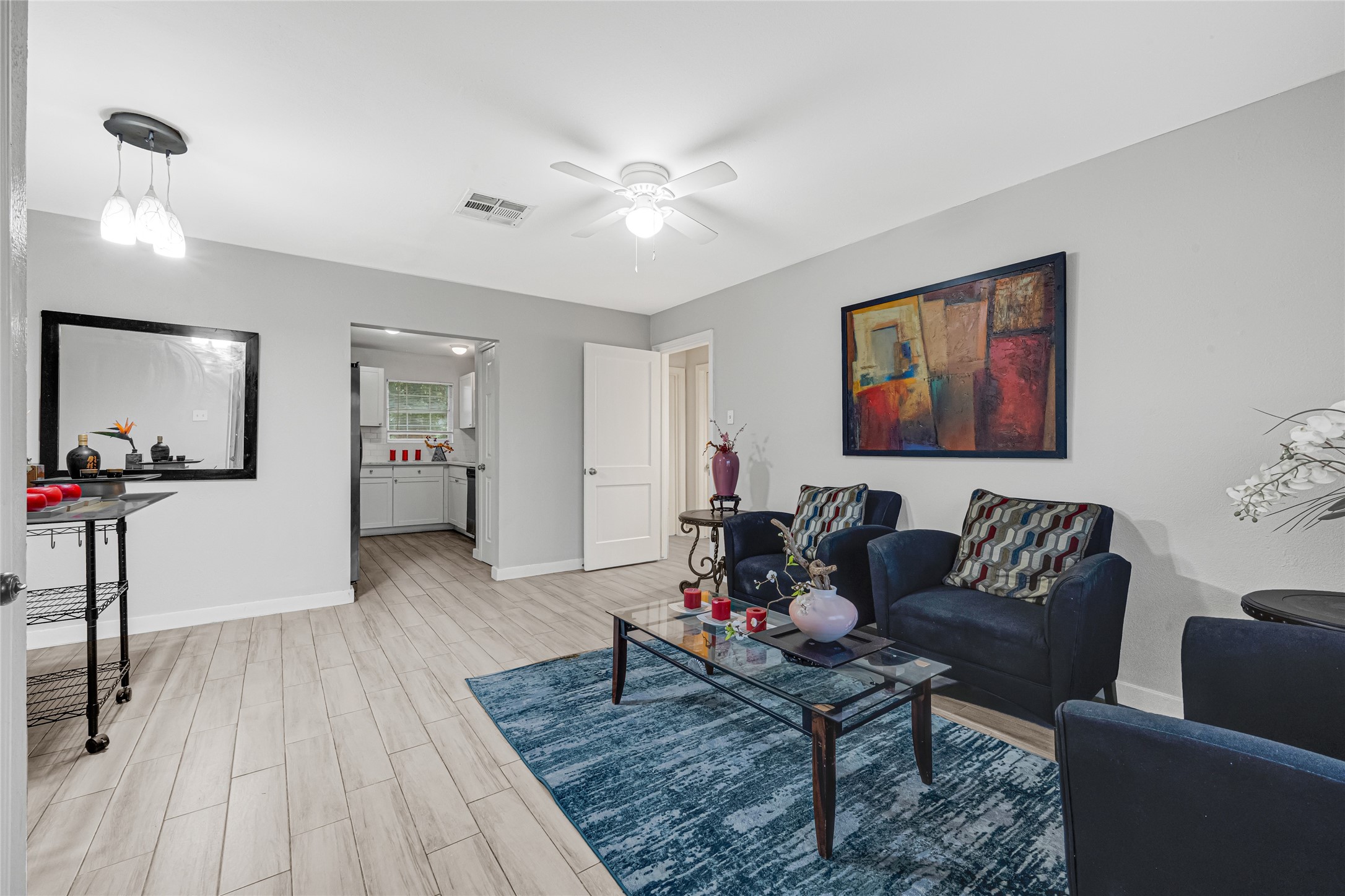 5009 Bataan Road Houston, TX 77033 - Photo 7 of 24 a living room with furniture and wooden floor