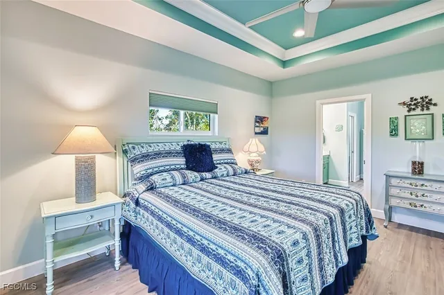 a bedroom with a bed and a lamp on table