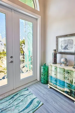 a view of room with window and wooden floor
