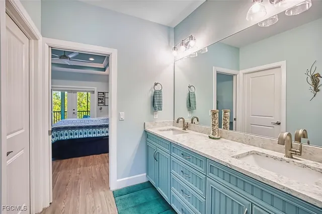 a bathroom with a double vanity sink and a mirror