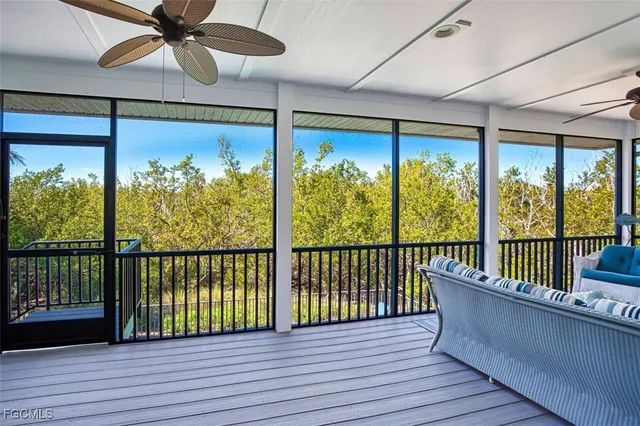 a view of a balcony with wooden floor