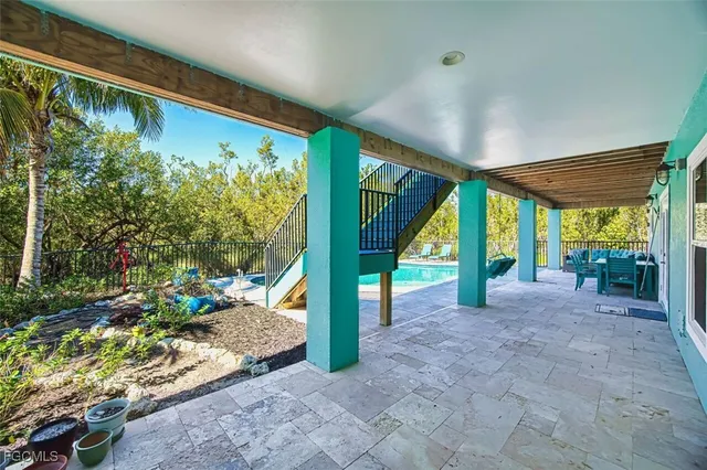 a view of a room with wooden floor and outdoor space
