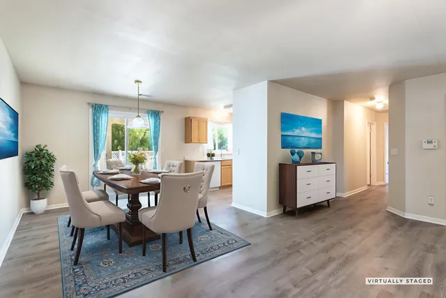 a view of a dining room with furniture and a livingroom