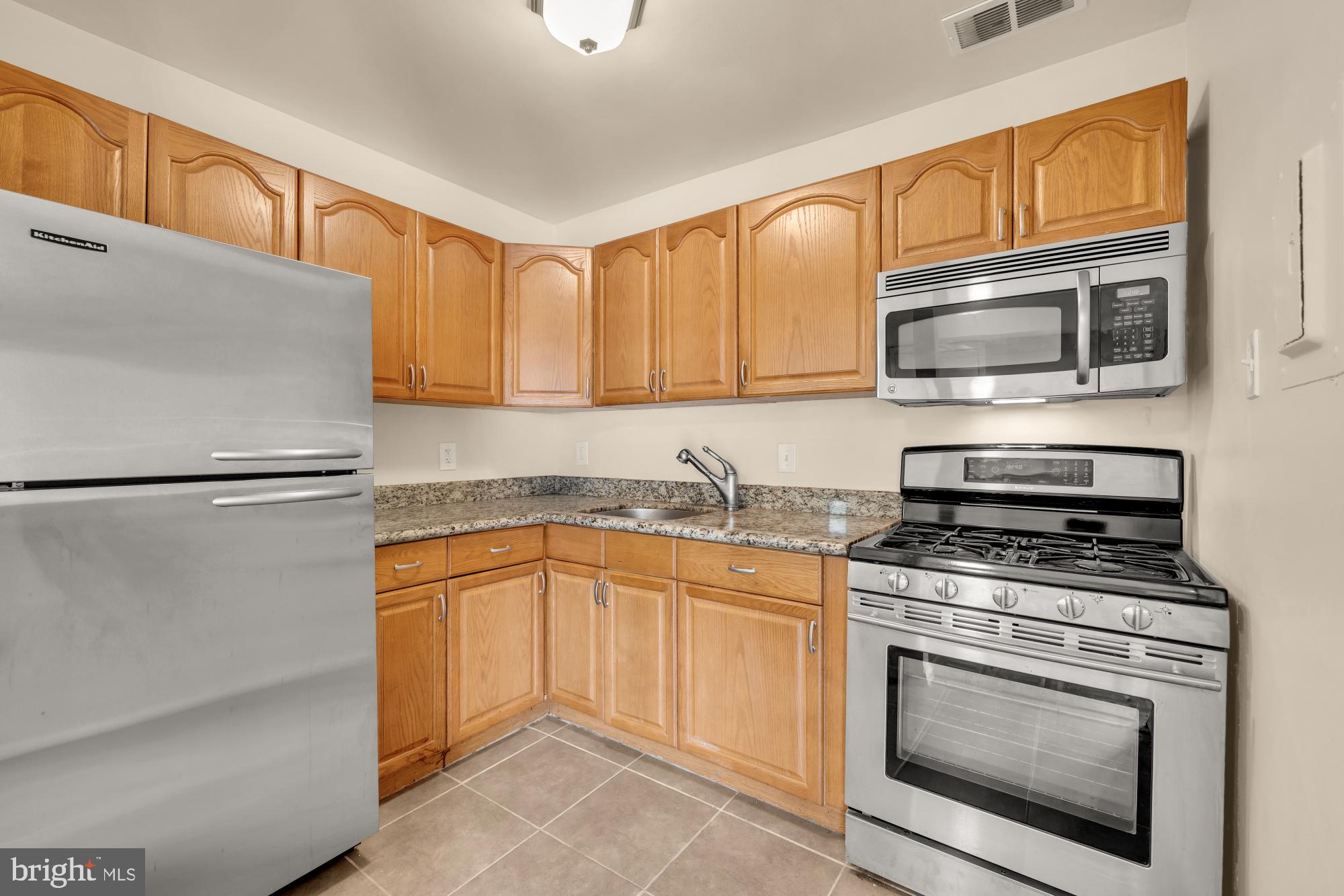 7056 Eastern Avenue Northwest, Unit 107 Washington, DC 20012 - Photo 15 of 36 Gas cooking, lots of cabinets!