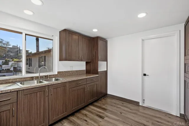 a kitchen with stainless steel appliances a stove microwave and cabinets