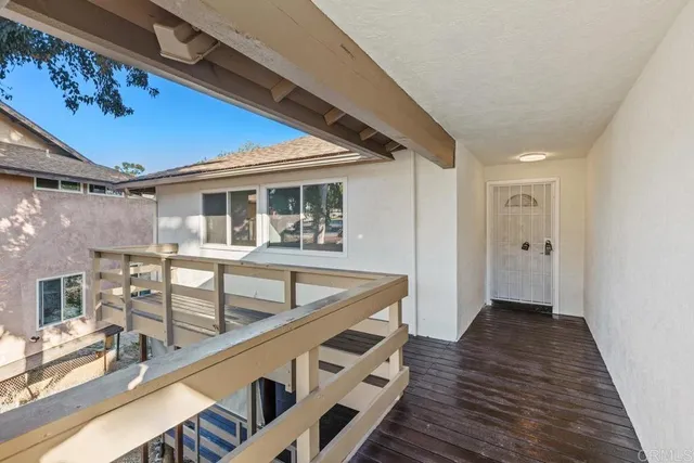 a sitting area with wooden floors and wooden roof