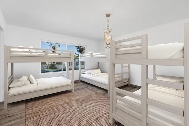 a view of a room with wooden floor and window
