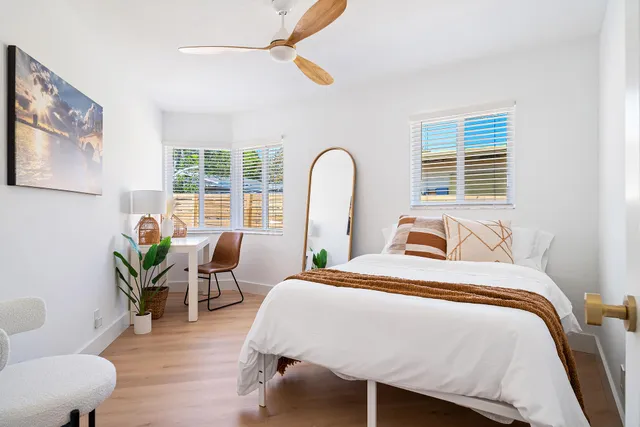 a bedroom with a bed and a couch