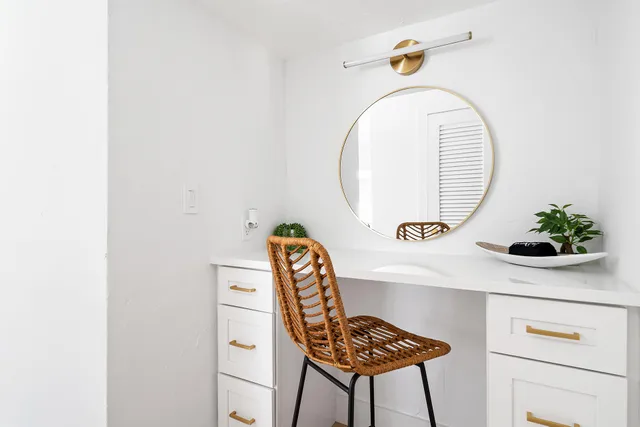 a picture of a bathroom with a sink and a mirror