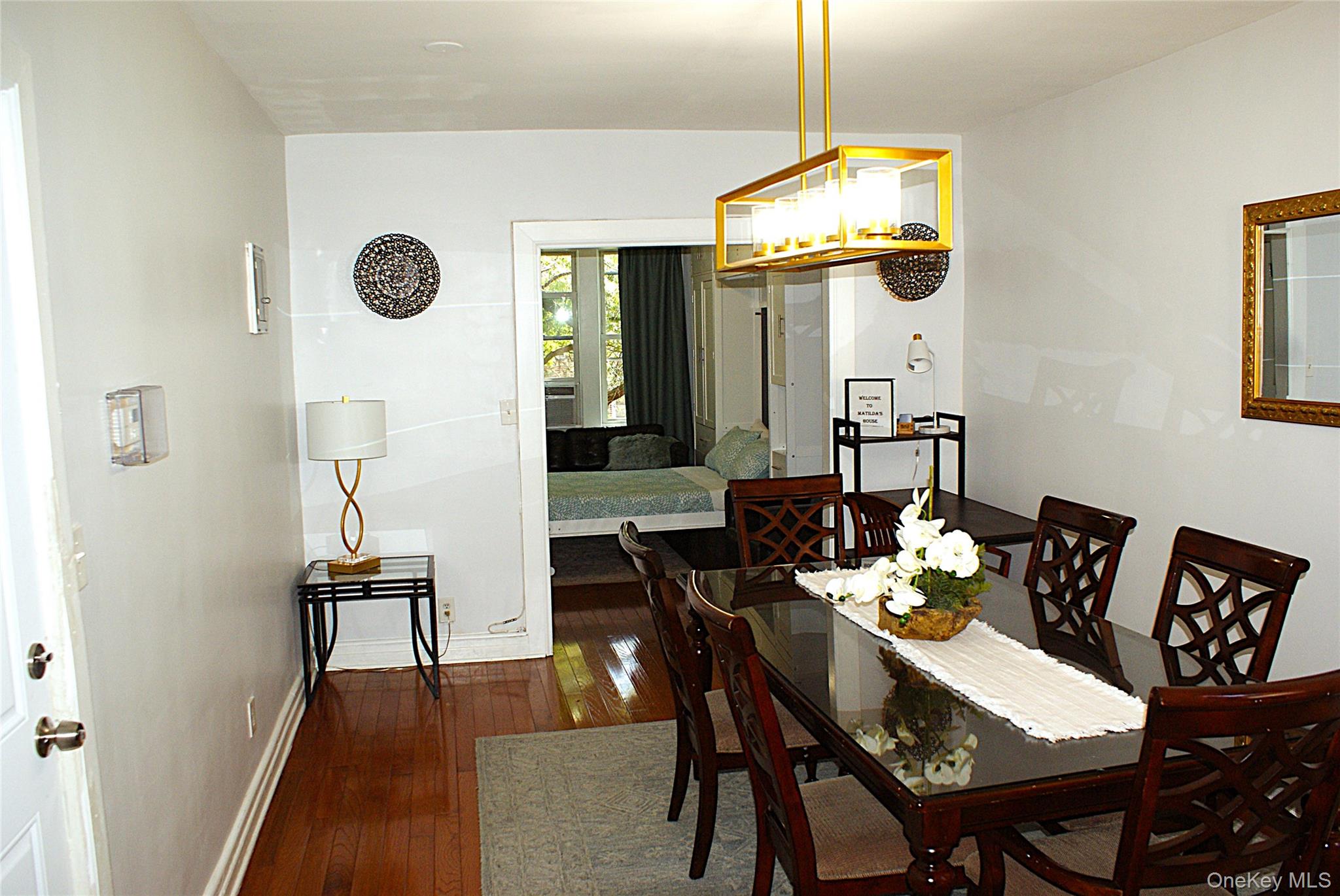 600 Flatbush Avenue Brooklyn, NY 11225 - Photo 13 of 17 Dining space with dark wood-style flooring and a chandelier