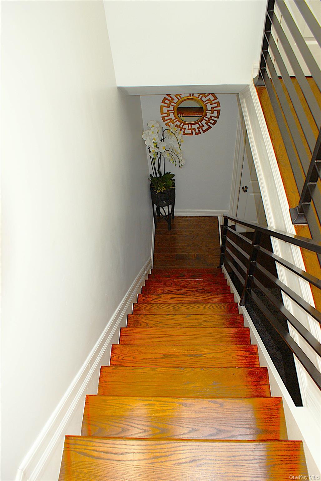 600 Flatbush Avenue Brooklyn, NY 11225 - Photo 6 of 17 Stairway featuring baseboards and wood finished floors