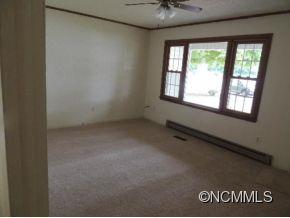 114 Fuller Court Rutherfordton, NC 28139 - Photo 3 of 6 an empty room with a window