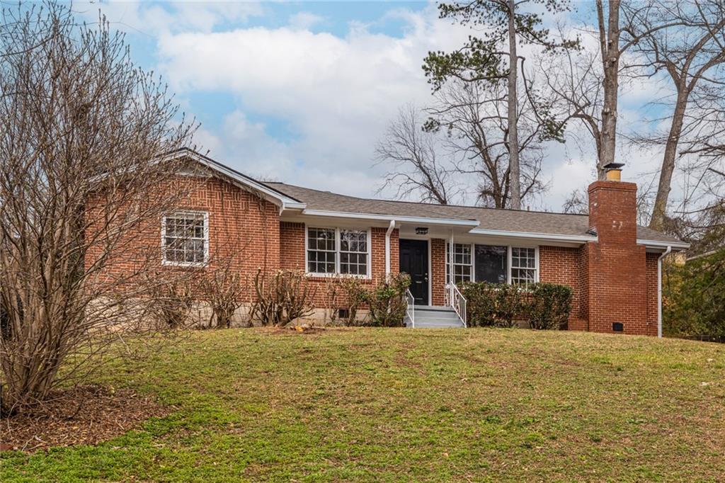2986 Belvedere Lane Decatur, GA 30032 - Photo 1 of 18 a front view of a house with yard and seating space