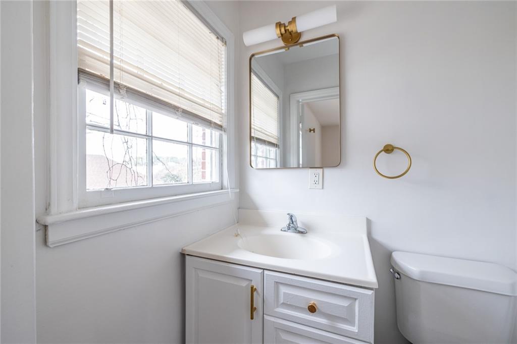 2986 Belvedere Lane Decatur, GA 30032 - Photo 11 of 18 a bathroom with a sink a toilet and a window
