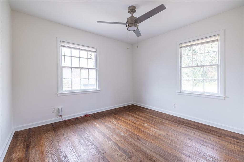 2986 Belvedere Lane Decatur, GA 30032 - Photo 12 of 18 a view of an empty room with wooden floor and a window
