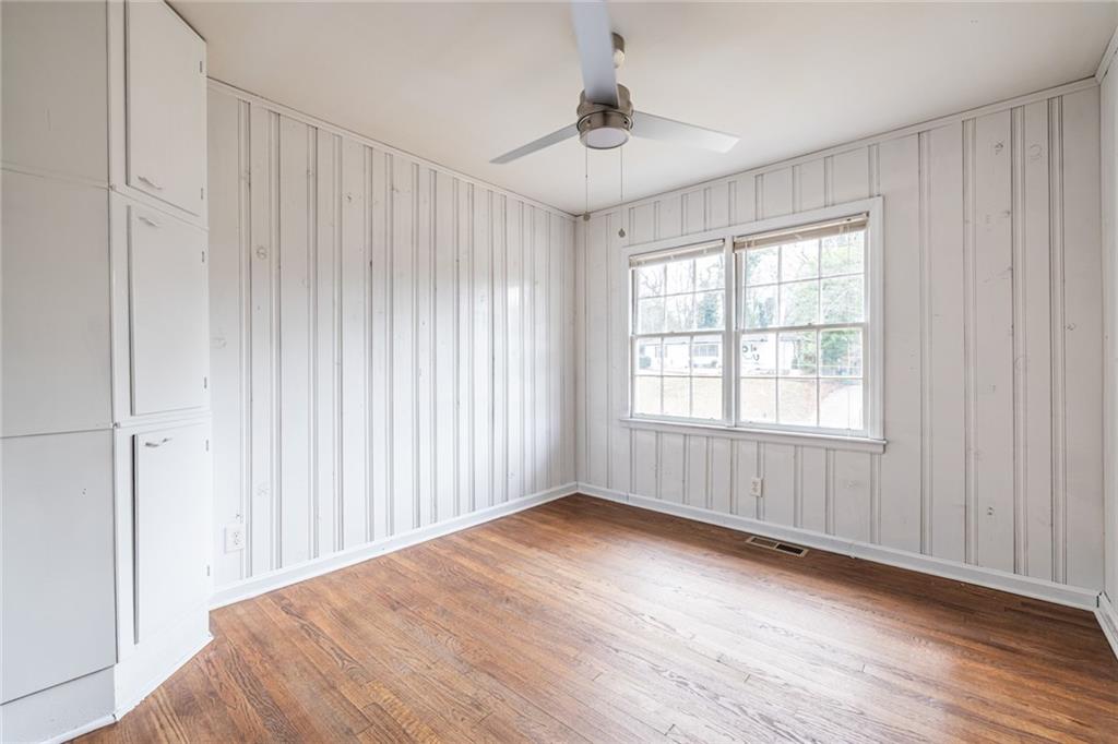 2986 Belvedere Lane Decatur, GA 30032 - Photo 14 of 18 wooden floor in an empty room with a window