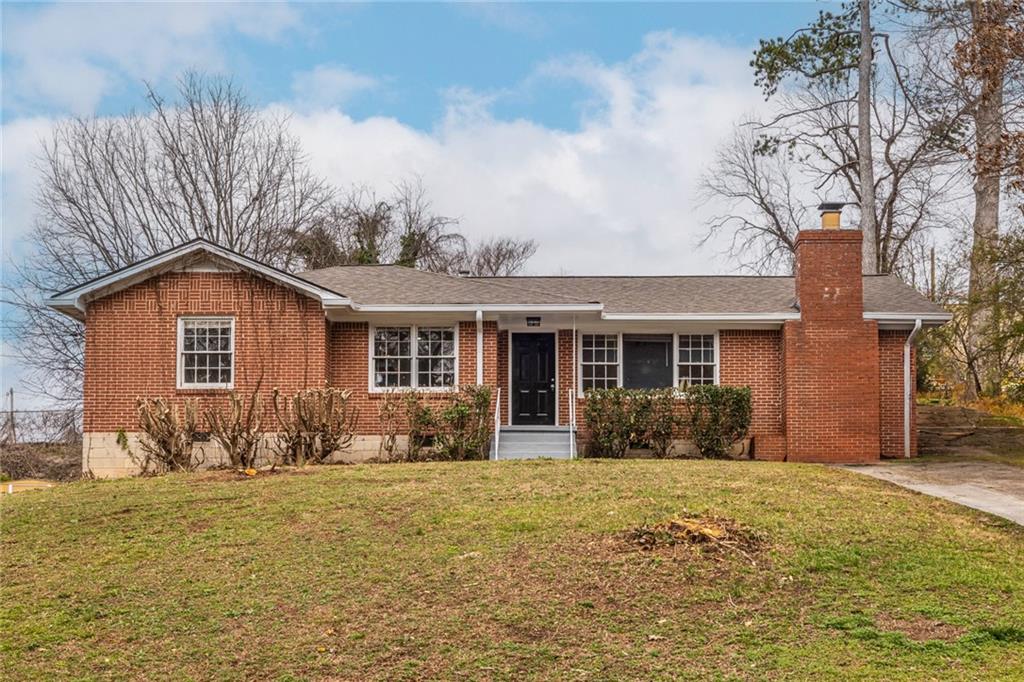 2986 Belvedere Lane Decatur, GA 30032 - Photo 2 of 18 a front view of a house with a yard
