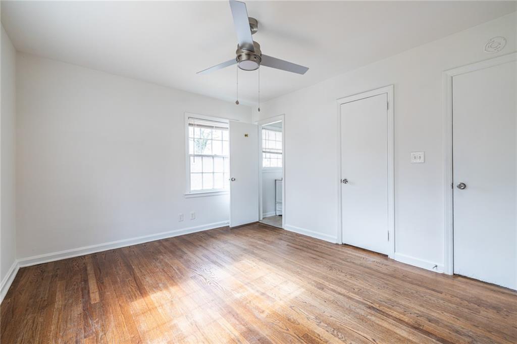 2986 Belvedere Lane Decatur, GA 30032 - Photo 10 of 18 a view of an empty room with wooden floor and a window
