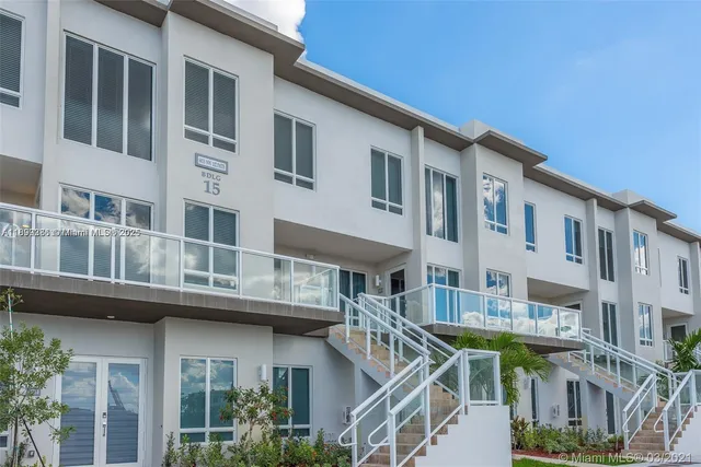 a front view of a building with a lot of windows