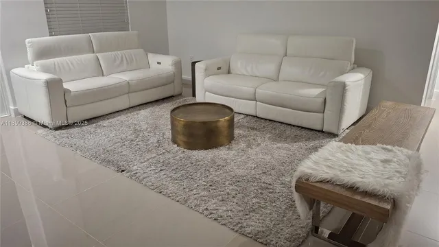 a living room with furniture and a couch