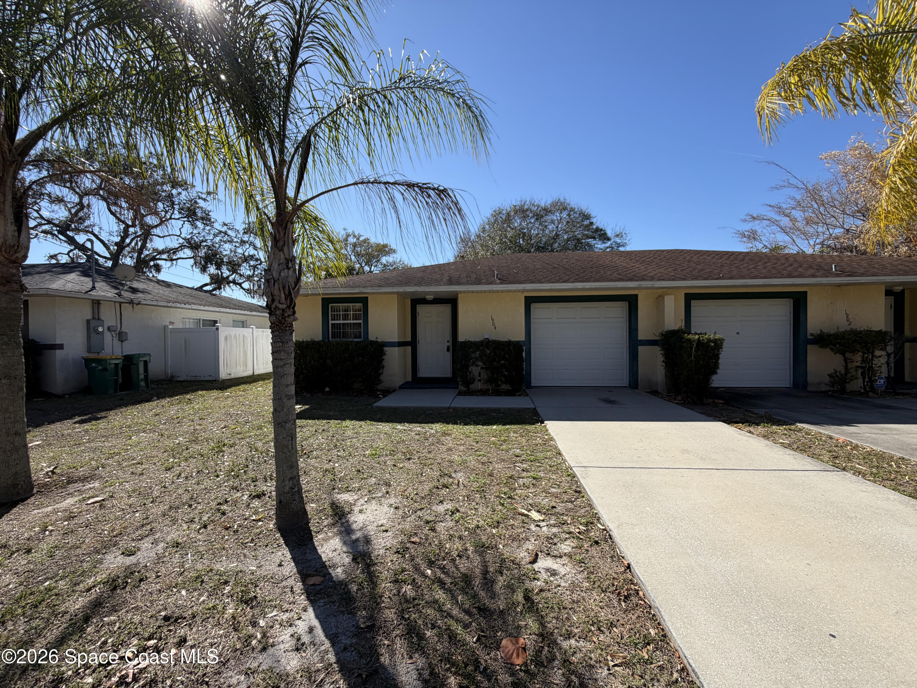 1904 Fletcher Street Melbourne, FL 32901 - Photo 1 of 23 a view of a house with a yard
