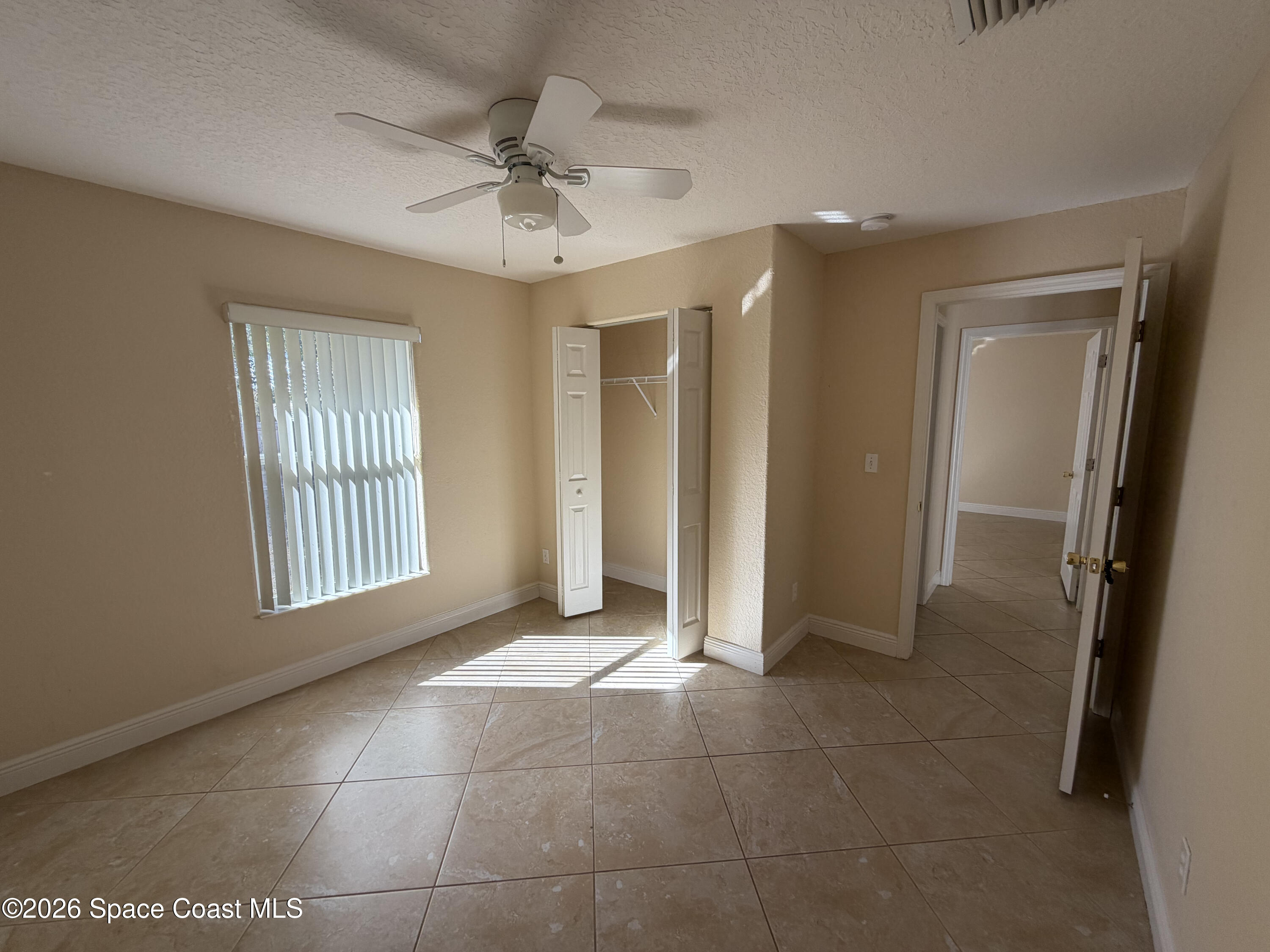 1904 Fletcher Street Melbourne, FL 32901 - Photo 14 of 23 a view of an empty room with a window