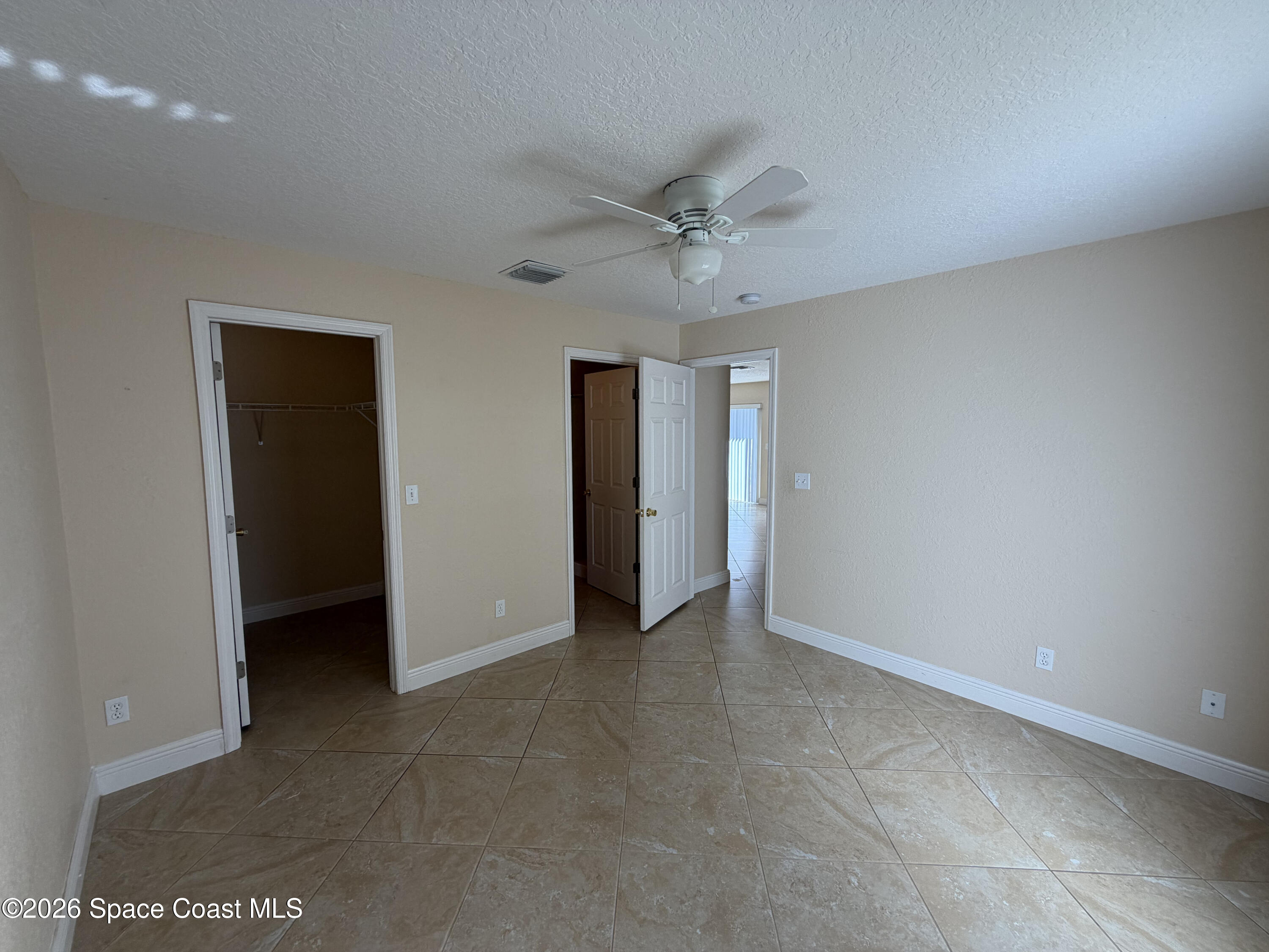 1904 Fletcher Street Melbourne, FL 32901 - Photo 16 of 23 a view of an empty room with a ceiling fan