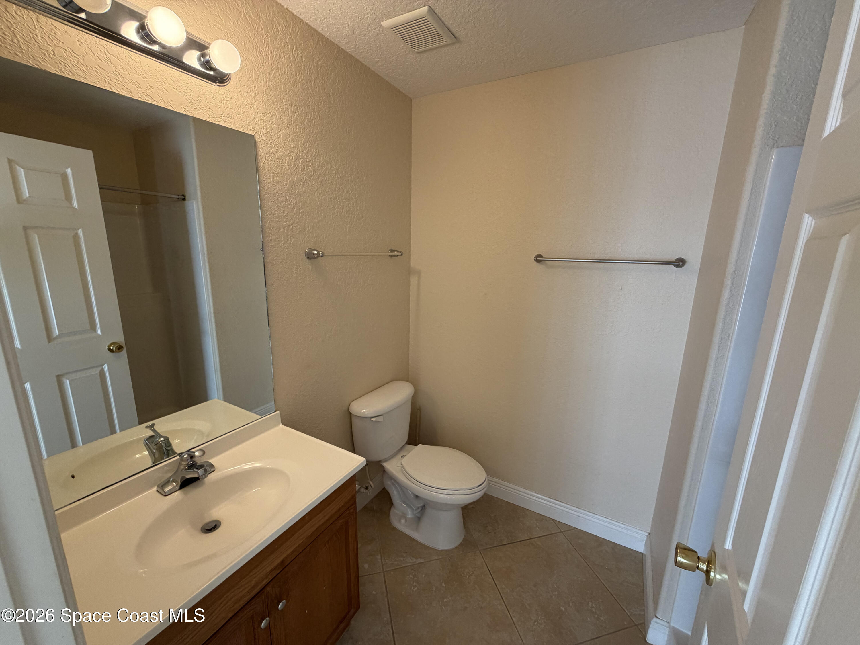 1904 Fletcher Street Melbourne, FL 32901 - Photo 17 of 23 a bathroom with a sink a toilet and shower